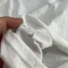 Camiseta de verano nueva blanca de manga corta, estilo casual con estampado de estrellas, para mujer, cuello redondo, corte holgado, top único y versátil, adelgazante