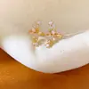 Pendientes de clip de estrella con incrustaciones de circonita para mujer sin perforaciones, pendientes de nicho únicos y elegantes, sensación de lujo ligero y alta gama, venta al por mayor