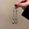 Pendientes largos con borlas y bola de estilo frío, ligeros y lujosos, para mujer, con un diseño elegante y moderno, joyería para las orejas.