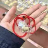 Pingente de Celular Dourado Desenho Animado "Fique Rico Instantaneamente" Chaveiro de Ouro Puro 999 Cordão Vermelho Enfeite para Pendurar no Carro Baixo Preço Presente Promocional