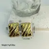 Brincos geométricos listrados em aço inoxidável estilo ins, europeus e americanos, transfronteiriços, modernos e versáteis, atacado de fabricantes de brincos transfronteiriços