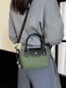 Bolso de hombro de nailon simple color block, bolso con forma de dumpling, versátil para primavera y verano, un bolso de mano de nicho y elegante con una textura de moda