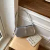 Bolso de axila de nicho de alta gama para mujer, bolso pequeño, nuevo modelo primavera-verano 2026, estilo suave, versátil para ir al trabajo, bolso de hombro y cruzado