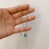 Collar con colgante geométrico de mariposa y circón en capas, estilo gota de agua azul, cadena doble con diseño de viento frío para clavícula.