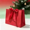 Bolsa de papel portátil con lazo de color, de fondo cuadrado, con embalaje exquisito, para regalo, ropa, compras, logotipo imprimible.