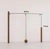 Estante de ropa de acero inoxidable montado en la pared para tienda de ropa, estante vintage color veta de madera de nogal, exhibidor de piso para ropa de mujer