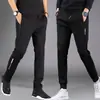 Pantalones casuales gruesos para hombre de primavera y otoño, joggers deportivos holgados de cintura alta de corte slim versátiles con cremallera y perneras rectas
