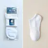 Calcetines de empaque individual para hombre, calcetines de algodón para hombre de color liso para otoño e invierno, calcetines para hombre al por mayor, calcetines deportivos de tubo largo para hombre