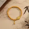 Pulseira de Lótus e Flor de Pessegueiro com Design de Contas de Transferência Antigas, Estilo Nicho, Versátil Nova Pulseira 2025 como Presente para Sua Namorada