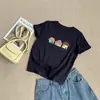 Camiseta de manga corta de color liso con estampado de casita estilo coreano, nuevo modelo primavera-verano 2026, cuello redondo, versátil, top juvenil y refrescante