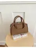 Bolsa de mano estilo nuevo para comercio electrónico transfronterizo 2026, bolsa tipo bowling para mujer, bolsa tipo almohada retro y única, bolso de hombro y bolso cruzado versátil