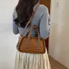 Bolso de mujer de nicho de lujo ligero, modelo nuevo 2026, bolso de hombro y cruzado vintage de alta gama, bolso de mano moderno y elegante