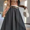 Foto real de la falda de lana estilo coreano de otoño/invierno 2026, de cintura alta, que cubre las caderas, adelgazante, de longitud media, con estampado de estrellas