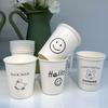 Taza desechable estilo ins engrosada comercial patrón de dibujos animados taza de papel para el hogar taza de leche de soja cara sonriente taza de agua al por mayor