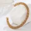 Europa y Estados Unidos dulce fresco grueso nuevo patrón pulsera abierta pulsera de acero de titanio dos colores sin decoloración en stock superpuesta año nuevo