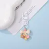 Chaveiro Pingente Urso de Resina Fofo com Laço de Bolinhas Coloridas Decoração de Sacola de Presente Cultural e Criativa DIY