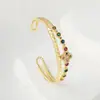 Pulseira de camada dupla de luxo leve da moda transfronteiriça, pulseira de trevo de quatro folhas com zircônio incrustado de cobre, pulseira popular na Amazon para mulheres, atacado
