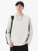 Camiseta de manga larga con cuello redondo para hombre, nuevo estilo primavera/otoño 2026, diseño retro japonés de moda, color liso, diseño estructurado con detalles de patchwork