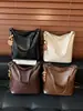 Bolso de hombro de diseño de nicho estilo coreano transfronterizo, moda retro para el día a día, para mujer, color liso, moderno, casual, bandolera tipo cubo