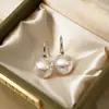 Aretes de Perla Rosa Doncella del Cielo Aurora Lujo Ligero Nicho Sensación de Alta Gama Ganchos para Orejas Moda de Verano Clavos Exagerados Pendientes
