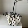 Bolso de mano grande de capacidad simple y elegante 2026 verano nuevo moda casual bolsa de trabajo de un solo hombro bajo el brazo