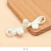 Botón de Cheongsam Hanfu Nuevo Estilo Chino Botón de Flor Oreja de Conejo de Perla de Jade Accesorios de Tejido Hecho a Mano para Mujer