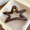 Elegante pinza para el pelo con estampado de leopardo negro y forma de estrella 2026 nuevo tamaño grande accesorio para el pelo para recogidos en la nuca