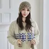Gorro de Cachemira Tejido a Mano con Ganchillo Transfronterizo al por Mayor con Diseño Bohemio Hueco y Borlas