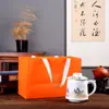 Taza de cerámica de tres piezas de Jingdezhen con asa filtro Wenchuang taza de separación de agua y té taza de regalo logotipo de la taza