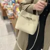 Bolso pequeño tipo cubo de piel de vaca de primera capa para mujer, Bolso de mano de alta gama para el trabajo, Bolso de hombro de piel de vaca Togo, Bolso cruzado para el trabajo
