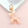 1079 # Llavero colgante de perro globo electrochapado creativo, exquisito accesorio para bolso y teléfono, pequeño regalo para regalar, venta al por mayor