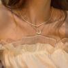 Collar de perlas con costura de amor, accesorios de hip-hop de verano, diseño con sentido de alta calidad, cadena de clavícula de lujo y nicho para mujer.