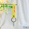 Nuevo llavero correa de goma blanda accesorio colgante para bolsa correa de cuero lindo llavero de PVC correa de goma blanda al por mayor