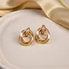 Pendientes de Metal con Temperamento Europeo y Americano para Mujer Círculo Dorado Nicho Lujo Ligero Moda Pendientes de Gama Alta Venta al por Mayor