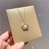 Chapado en oro de 14 quilates estilo coreano Donggate Diamante Ópalo flor sonrisa cadena para clavícula collar de pétalos
