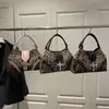 Bolso de Mano con Estampado de Leopardo Estilo Coreano para Mujer 2026 Primavera Nuevo Dulce y Fresco Chica Picante Bolsa Tote de Gran Capacidad Bolso de Hombro Elegante