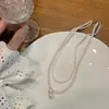 Colar Dupla Camada Pérola Retrô Francês Acessórios de Miçangas de Milho Feminino Luxo Acessível de Alto Padrão Nicho Corrente de Clavícula Gargantilha