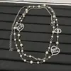 Nueva Cadena de Suéter con Letra C Doble Estilo Chanel, Corazón y Perla, No se Desvanece, Versión Gruesa Electroplateada al Vacío de Alta Calidad, Artesanía de Precisión para Ventas Transfronterizas