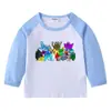 Camiseta infantil de primavera y otoño 2023, nueva camiseta de manga larga con cuello redondo y dibujos animados, camiseta de algodón para bebés y niños.