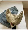 Bolsa de Bolinho Design de Nicho Estilo Coreano Bolsa Feminina 2026 Nova Grande Capacidade Casual Bolsa Transversal Bolsa de Lona Leve da Moda