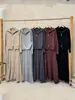 Nuevo Conjunto de Dos Piezas para Mujer Otoño/Invierno 2026: Cárdigan de Punto con Cuello Solapa y Doble Cremallera + Falda de Cintura Alta Estilo Casual