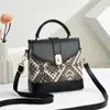 Bolsas de Alta Gama Verano 2025 Nueva Bolso Mini Cuadrado Portátil para Mujer Moda y Versátil Cruzado Teléfono Móvil Periódico
