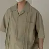 Camisa de solapa estilo japonés para hombre, camisa casual de color liso juvenil para verano, versátil y holgada