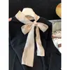 Tiro real suéter de punto con lazo retro francés invierno mangas de campana estilo perezoso dobladillo irregular capa interior camisa base
