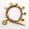 Pulsera tejida a mano estilo Tíbet con Cinco Deidades de la Riqueza, Pulsera Thangka, Colgante Ojo del Dharma del Dios de la Riqueza, Pulsera de Hilo Rojo con Cascabel