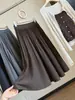 Saia midi plissada de lã estilo preppy coreano para mulheres, nova coleção outono 2026, cintura alta, modelagem A que afina e valoriza a silhueta