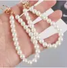 Llavero directo de fábrica hebilla de puerta colgante para teléfono móvil diy perla de imitación bolsa pequeña corta cartera muñeca cadena de mano venta al por mayor