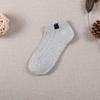 Calcetines calcetines de barco para mujer boca baja verano nuevo jacquard tela de imitación etiqueta de tela transpirable desodorante calcetines de tubo corto para amantes venta al por mayor
