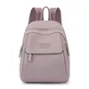 Mochila de mujer bolsa de tela de nailon nueva moda simple mochila escolar mini para damas ocio viaje mochila pequeña venta al por mayor