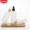 Botella transparente esmerilada de 30 ml para aceites esenciales, botella cosmética, botella vacía, botella con gotero de cabeza de plástico de 10 ml, subbotella para loción, venta al por mayor